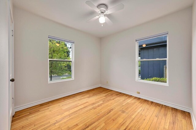 6102 Laird Dr, Austin, TX 78757 - empty room featuring light wood-type flooring and a ceiling fan