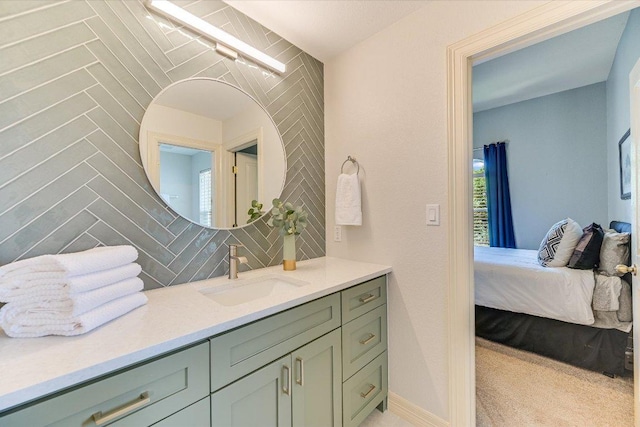 280 Whitney Run, Buda, TX 78610 - bathroom featuring vanity, backsplash, ensuite bath, and healthy amount of natural light