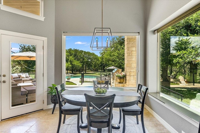 280 Whitney Run, Buda, TX 78610 - dining room featuring a chandelier and light stone finish flooring
