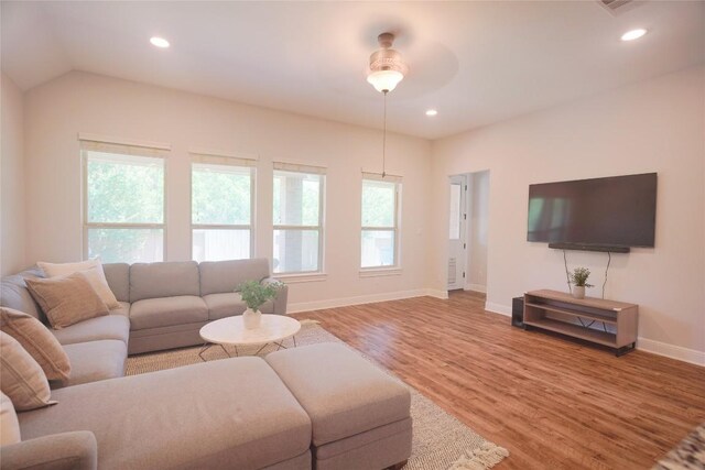 2301 Yaupon Range Dr, Leander, TX 78641 - living room featuring wood finished floors and recessed lighting