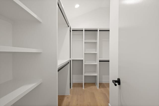 3402 Goodwin Ave Unit 1, Austin, TX 78702 - spacious closet with light wood-type flooring and vaulted ceiling