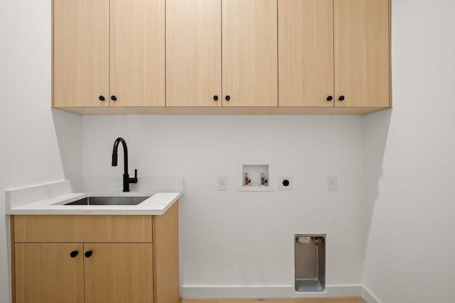 3402 Goodwin Ave Unit 1, Austin, TX 78702 - washroom featuring hookup for an electric dryer, washer hookup, and cabinet space