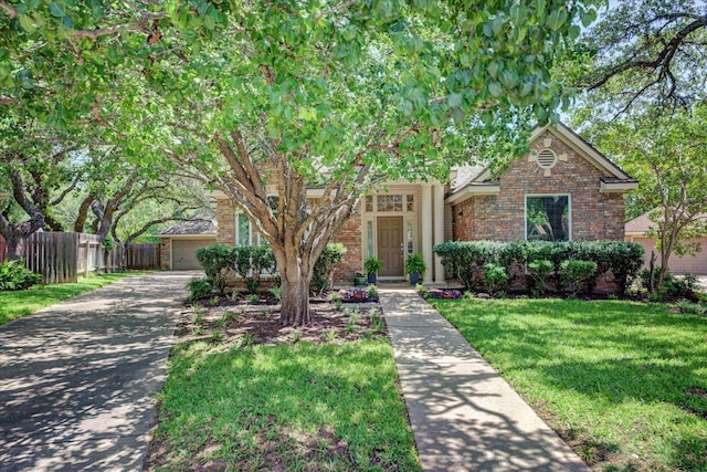8500 E Potosi Cv, Austin, TX 78717 - obstructed view of property featuring brick siding and driveway
