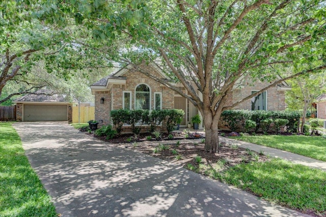 8500 E Potosi Cv, Austin, TX 78717 - view of front of house featuring brick siding, a garage, and driveway