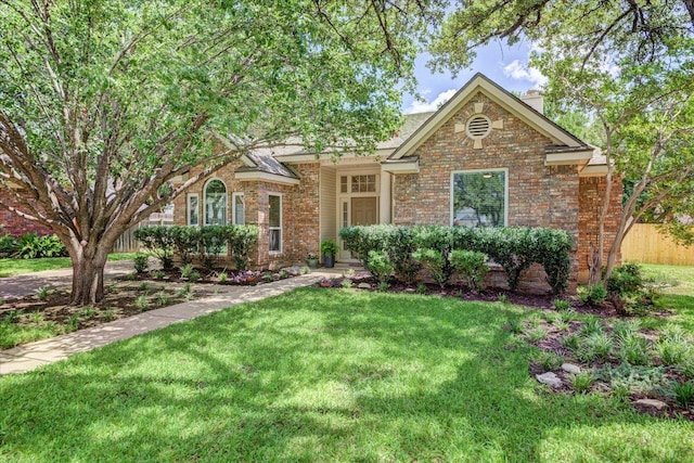 8500 E Potosi Cv, Austin, TX 78717 - view of front facade featuring brick siding, a chimney, and a front lawn