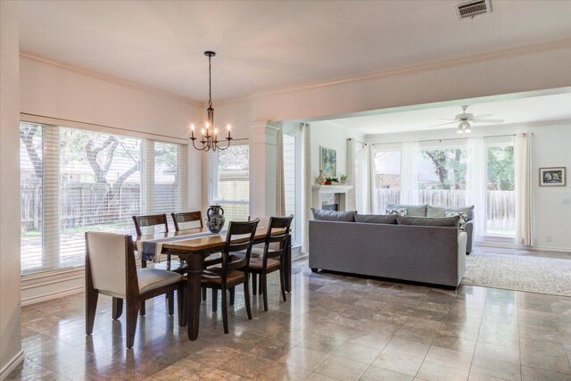 8500 E Potosi Cv, Austin, TX 78717 - dining space with a chandelier, ornamental molding, and a ceiling fan