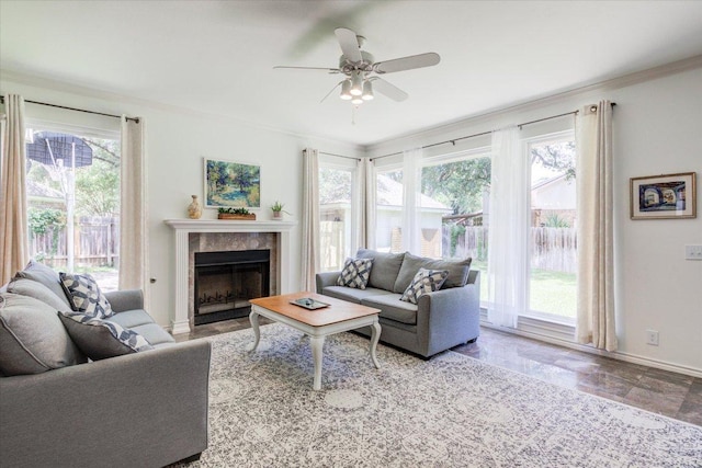 8500 E Potosi Cv, Austin, TX 78717 - living room with ornamental molding, ceiling fan, and a fireplace