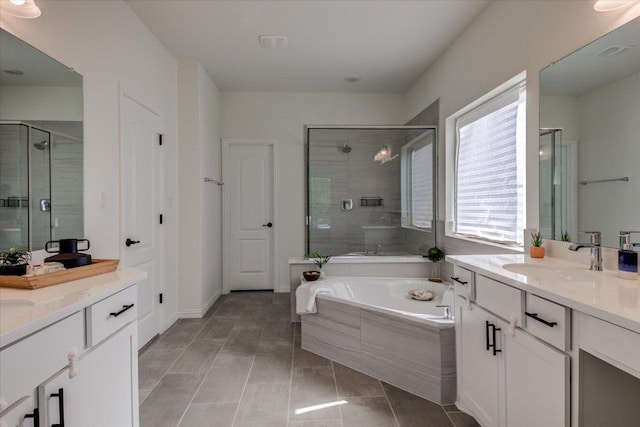 17816 Clairess Ln, Manor, TX 78653 - bathroom with two vanities, a bath, and a stall shower