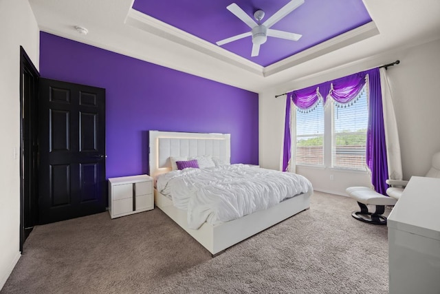 12000 Kincardine Way, Austin, TX 78754 - bedroom with a tray ceiling, carpet floors, crown molding, and a ceiling fan