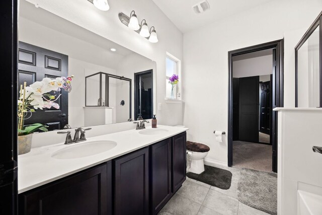 12000 Kincardine Way, Austin, TX 78754 - full bathroom with a shower with shower door, double vanity, and tile patterned floors
