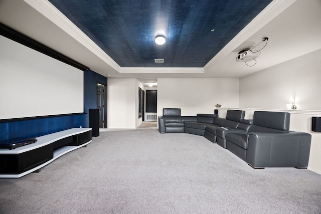 12000 Kincardine Way, Austin, TX 78754 - carpeted cinema featuring a tray ceiling and ornamental molding