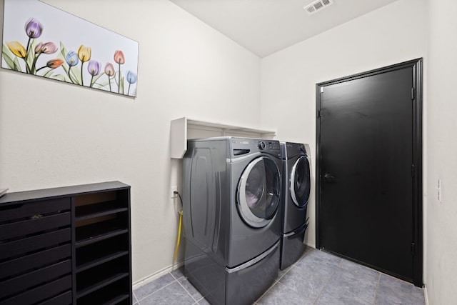 12000 Kincardine Way, Austin, TX 78754 - washroom featuring washing machine and dryer and light tile patterned flooring