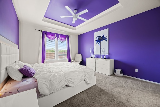 12000 Kincardine Way, Austin, TX 78754 - carpeted bedroom featuring a tray ceiling and ceiling fan