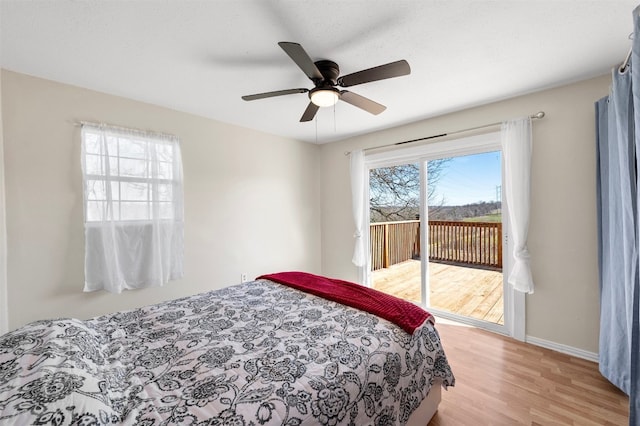 175 Settlers Trl, Elgin, TX 78621 - bedroom with access to exterior, light wood-style floors, and a ceiling fan