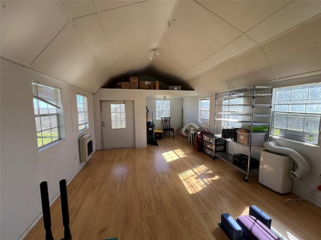 175 Settlers Trl, Elgin, TX 78621 - living area featuring heating unit, vaulted ceiling, and wood finished floors