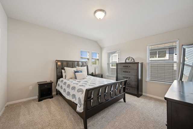8713 Alderman Dr, Austin, TX 78747 - bedroom featuring light colored carpet and vaulted ceiling