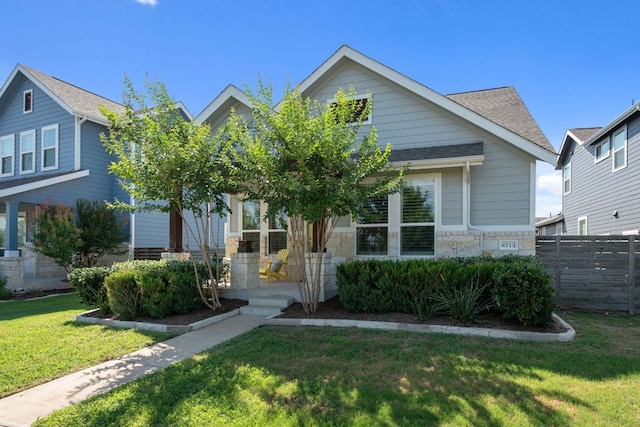 8713 Alderman Dr, Austin, TX 78747 - view of front facade featuring stone siding and roof with shingles