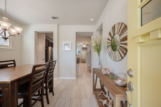 8713 Alderman Dr, Austin, TX 78747 - dining room with a ceiling fan and a chandelier