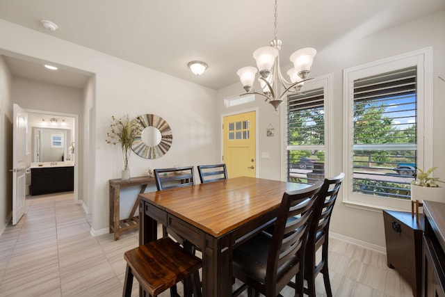 8713 Alderman Dr, Austin, TX 78747 - dining space with a chandelier and plenty of natural light