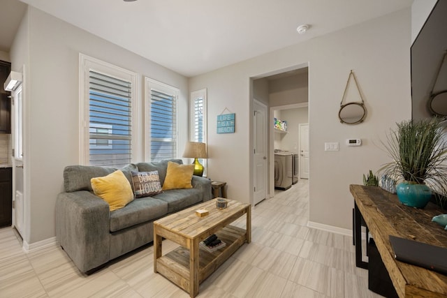 8713 Alderman Dr, Austin, TX 78747 - living room with washing machine and dryer and baseboards