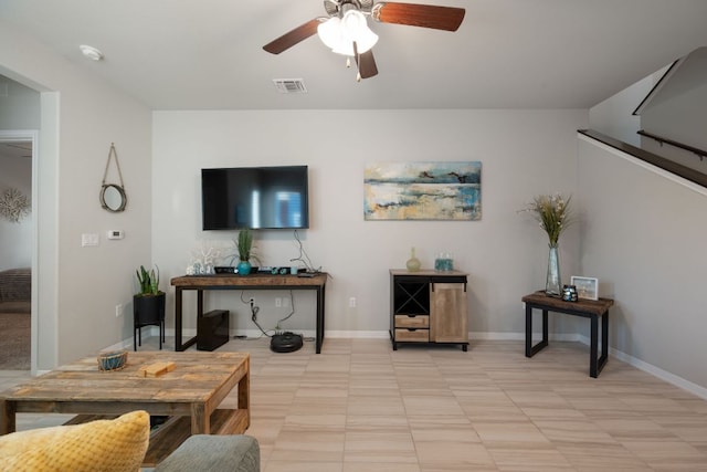 8713 Alderman Dr, Austin, TX 78747 - living area featuring a ceiling fan and baseboards