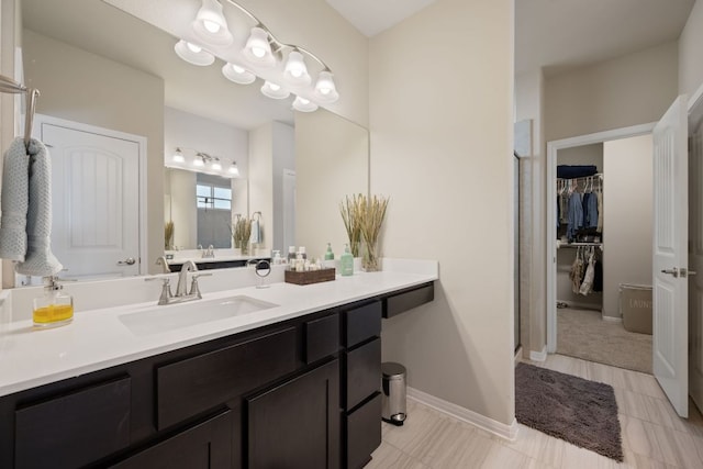 8713 Alderman Dr, Austin, TX 78747 - full bath featuring vanity and a walk in closet
