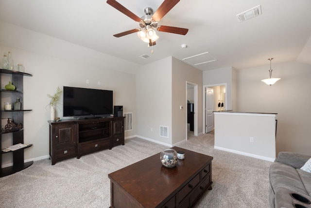 8713 Alderman Dr, Austin, TX 78747 - living area with vaulted ceiling, light carpet, a ceiling fan, and attic access