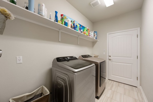 8713 Alderman Dr, Austin, TX 78747 - laundry area featuring independent washer and dryer and baseboards