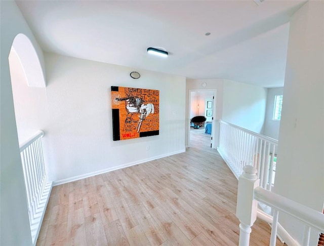 12504 Gun Metal Dr, Austin, TX 78739 - hall with light wood finished floors and an upstairs landing