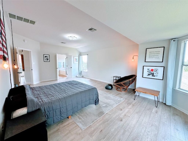 12504 Gun Metal Dr, Austin, TX 78739 - bedroom with light wood-style flooring and lofted ceiling