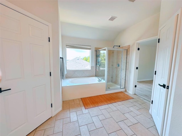 12504 Gun Metal Dr, Austin, TX 78739 - full bath with lofted ceiling, a stall shower, and a bath