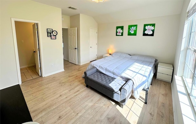 12504 Gun Metal Dr, Austin, TX 78739 - bedroom with light wood-style flooring and vaulted ceiling