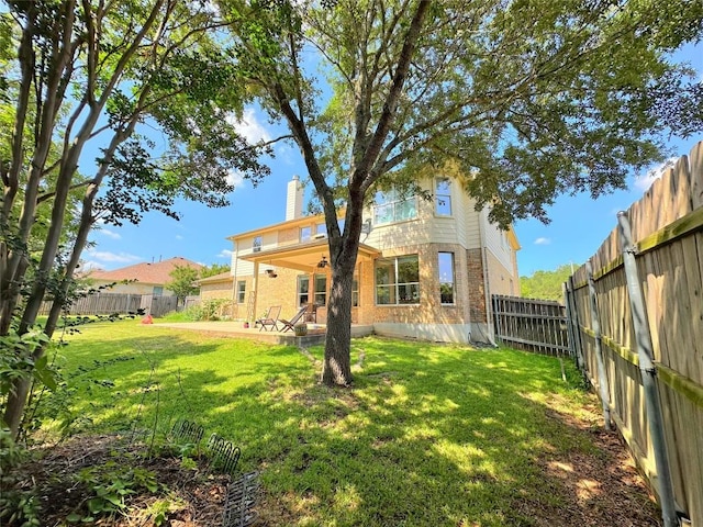 12504 Gun Metal Dr, Austin, TX 78739 - fenced backyard with a patio area