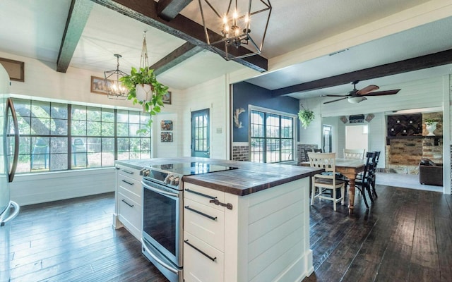 4204 Deer Tract St, Round Rock, TX 78681 - kitchen with electric range, a chandelier, beamed ceiling, butcher block counters, and dark wood finished floors