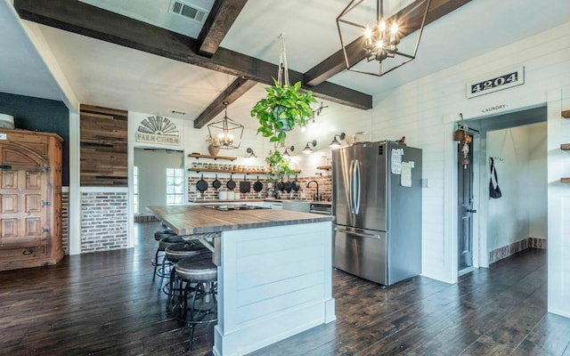 4204 Deer Tract St, Round Rock, TX 78681 - kitchen with freestanding refrigerator, wooden counters, open shelves, a chandelier, and dark wood finished floors