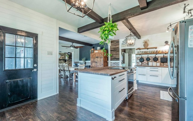 4204 Deer Tract St, Round Rock, TX 78681 - kitchen featuring appliances with stainless steel finishes, butcher block counters, dark wood-style flooring, beamed ceiling, and white cabinetry