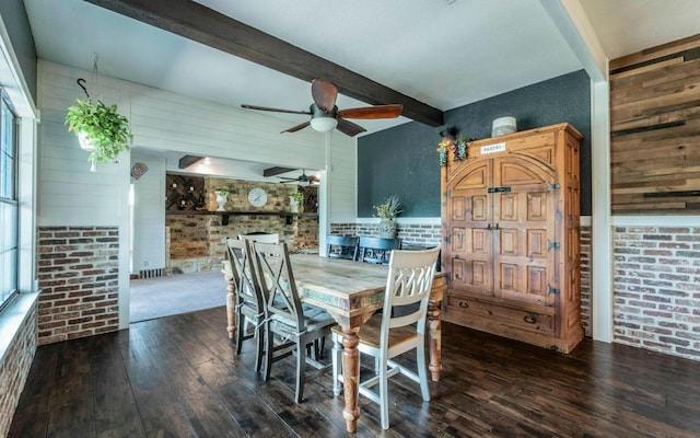 4204 Deer Tract St, Round Rock, TX 78681 - dining room featuring beamed ceiling, a ceiling fan, hardwood / wood-style floors, wood walls, and brick wall