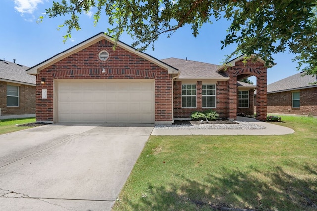 3713 Eagle Fledge Ter, Pflugerville, TX 78660 - view of front of house with brick siding, a front yard, driveway, and an attached garage