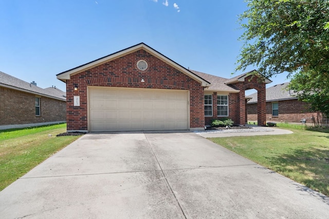 3713 Eagle Fledge Ter, Pflugerville, TX 78660 - view of front of property with brick siding, driveway, a front lawn, an attached garage, and roof with shingles
