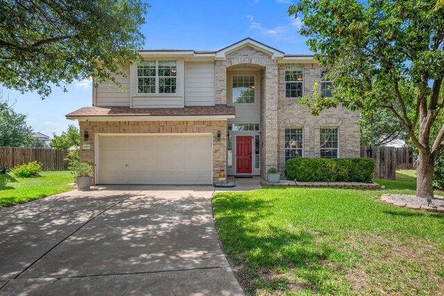 1913 Avante Dr, Cedar Park, TX 78613 - traditional-style home with concrete driveway, an attached garage, and brick siding