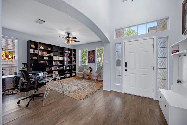 1913 Avante Dr, Cedar Park, TX 78613 - home office with dark wood-type flooring, arched walkways, and ceiling fan