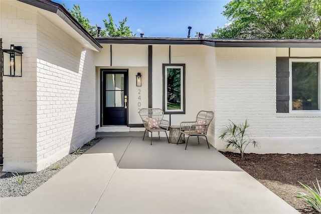 2402 Broken Oak Dr, Austin, TX 78745 - entrance to property with brick siding and a porch