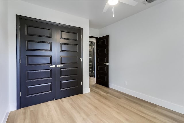 2402 Broken Oak Dr, Austin, TX 78745 - unfurnished bedroom featuring wood finished floors and a closet