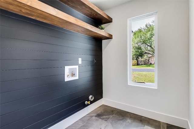 2402 Broken Oak Dr, Austin, TX 78745 - laundry room featuring hookup for a washing machine and wooden walls