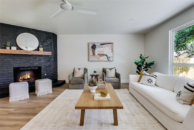 2402 Broken Oak Dr, Austin, TX 78745 - living area featuring wood finished floors, ceiling fan, and a fireplace
