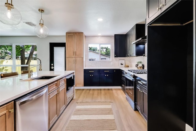 2402 Broken Oak Dr, Austin, TX 78745 - kitchen with dishwasher, range with gas stovetop, light wood-style flooring, healthy amount of natural light, and recessed lighting