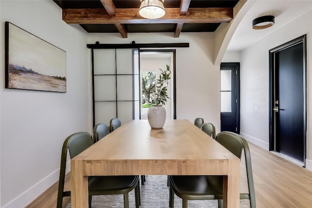 2402 Broken Oak Dr, Austin, TX 78745 - dining room featuring light wood-type flooring, beamed ceiling, coffered ceiling, and a barn door