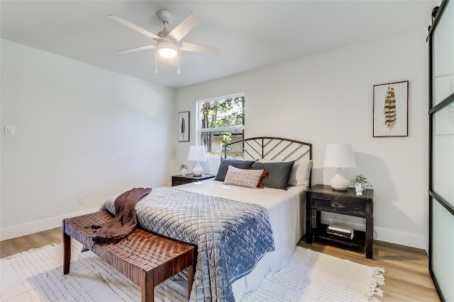 2402 Broken Oak Dr, Austin, TX 78745 - bedroom featuring wood finished floors and ceiling fan