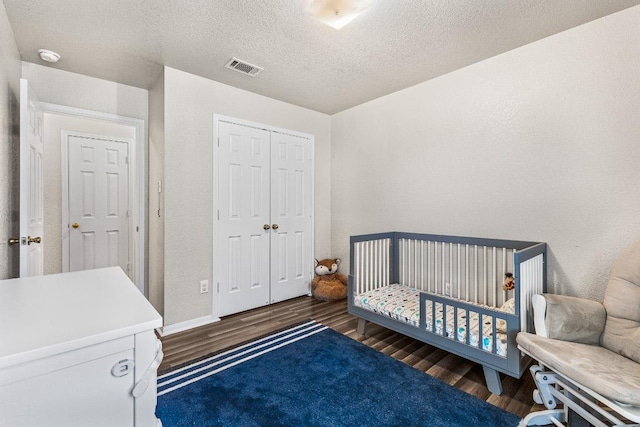 5302 Oster Dr, Killeen, TX 76542 - bedroom featuring wood finished floors, a closet, and a textured ceiling