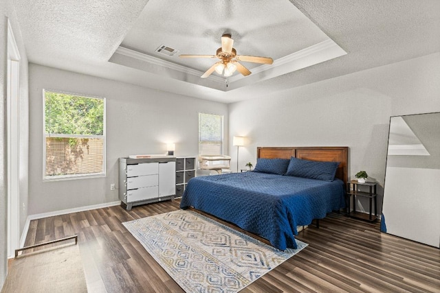 5302 Oster Dr, Killeen, TX 76542 - bedroom with a raised ceiling, wood finished floors, crown molding, a textured ceiling, and ceiling fan